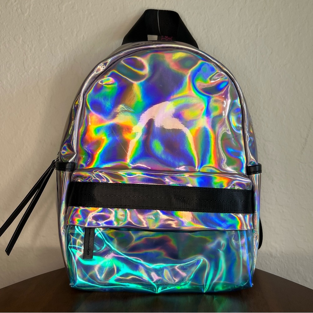 NWT iridescent festival mini backpack. Adjustable straps. Clear front pocket.